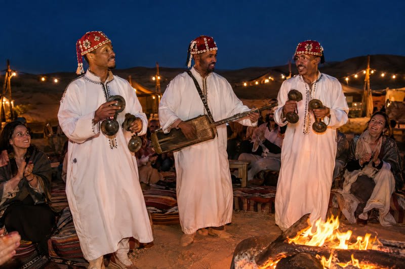 Gnawa musicians playing by the fire